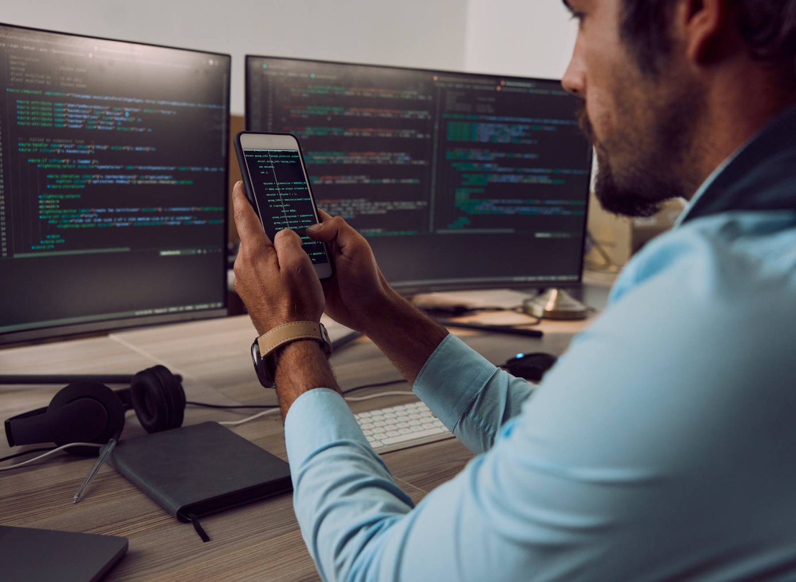 coding-computer-screen-and-phone-with-man